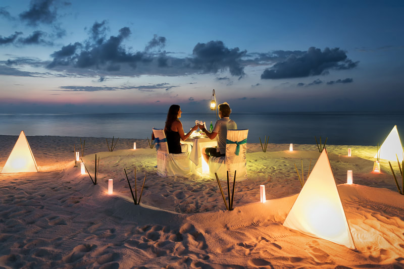 romantic candlelit dinner on beach